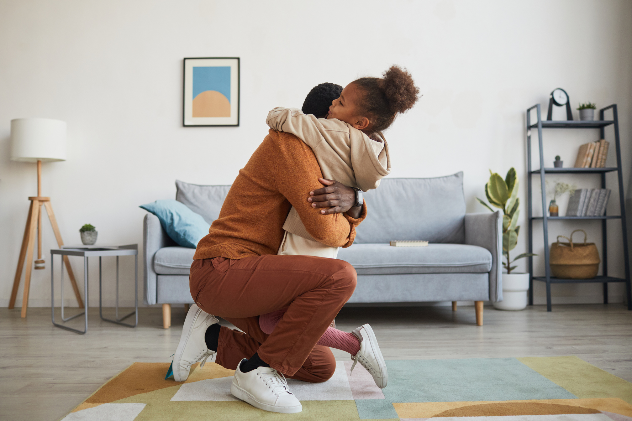 Girl Embracing Father Coming Home